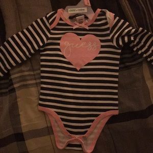 A baby guess long sleeved onesie. Never been worn